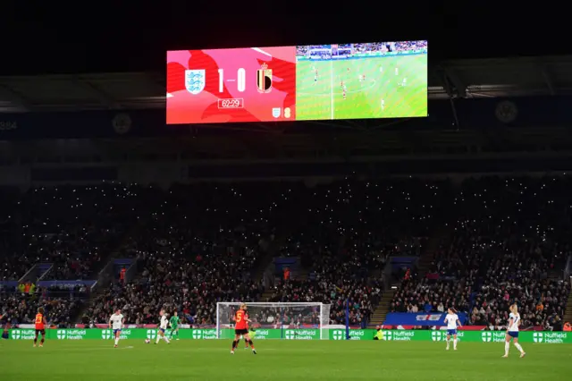 Fans hold up phone torches during the England v Belgium - UEFA Women's Nations League match at King Power Stadium on October 27, 2023 in Leicester, United Kingdom.