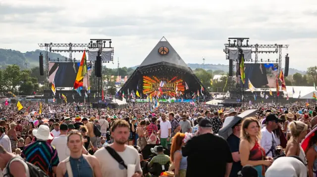 a view of the pyramid stage surrounded by thousands of fans
