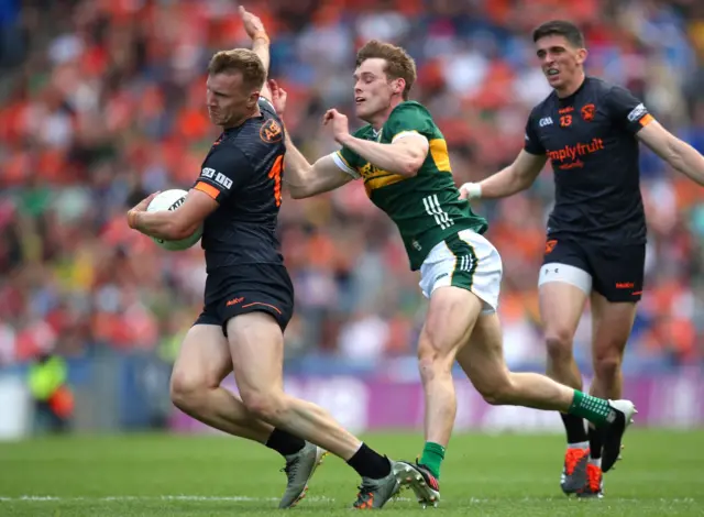 Armagh's Rian O'Neill is challenged by Gavin White during last year's semi-final