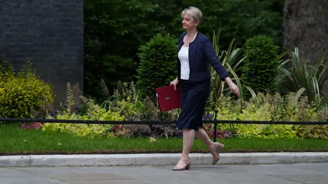 Home Secretary Yvette Cooper arrives for a cabinet meeting carrying a burgundy folder