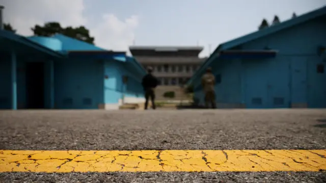 A yellow line marks the boundary between North and South Korea at the demilitarised zone.