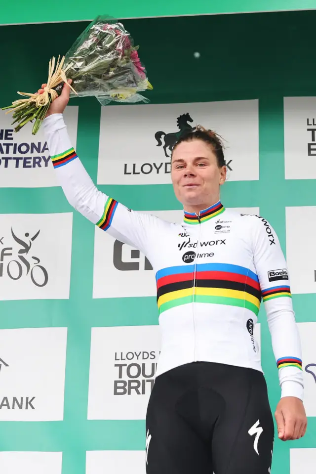Lotte Kopecky of Belgium and Team SD Worx-Protime celebrates at podium as overall race winner