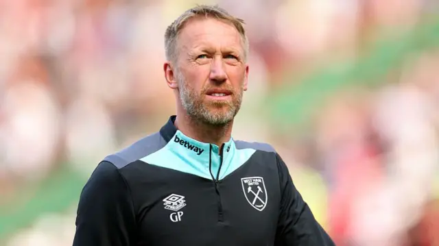 Graham Potter, Manager of West Ham United looks on