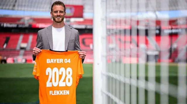 The newly signed goalkeeper Mark Flekken of Leverkusen poses for a photo