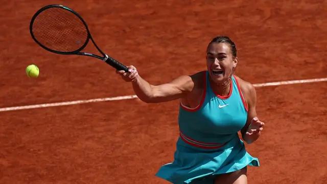 Aryna Sabalenka plays a forehand return