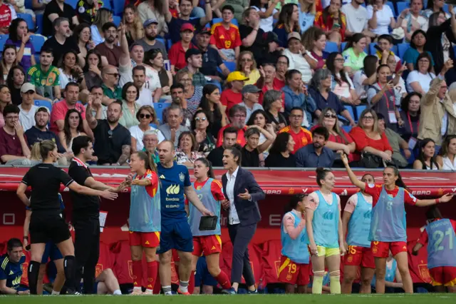 The Spain bench complain at a decision