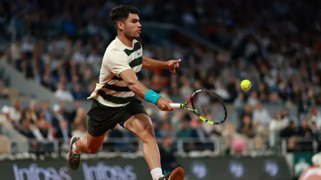 Carlos Alcaraz plays a forehand