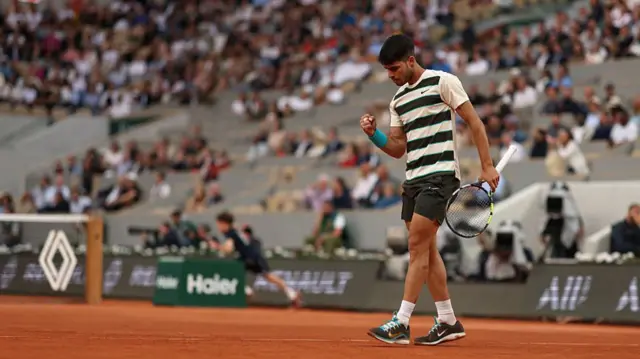 Carlos Alcaraz reacts to winning a point