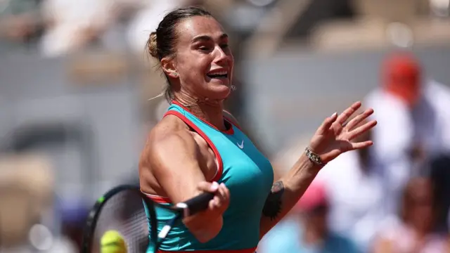 Aryna Sabalenka plays a forehand return