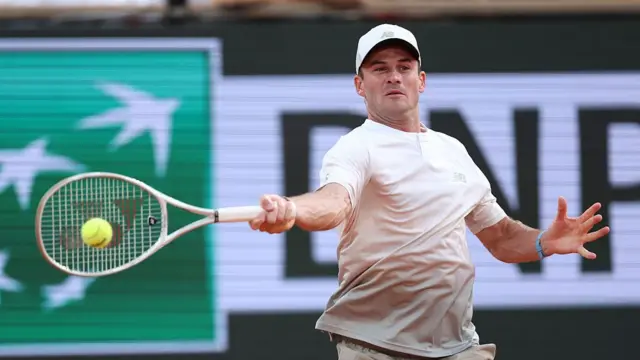 Tommy Paul plays a forehand