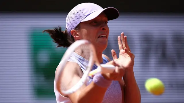 Iga Swiatek plays a forehand return