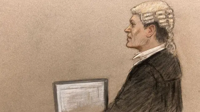 A sketch shows a lawyer, dressed black robes, reading off a piece of paper