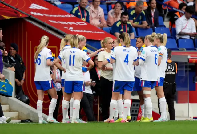 Wiegman chats to her players on the touchline