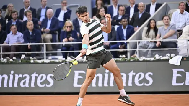 Carlos Alcaraz plays a forehand winner