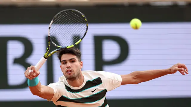Carlos Alcaraz plays a forehand