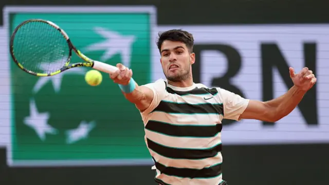 Carlos Alcaraz plays a forehand