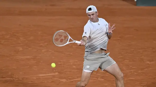 Tommy Paul hits a forehand