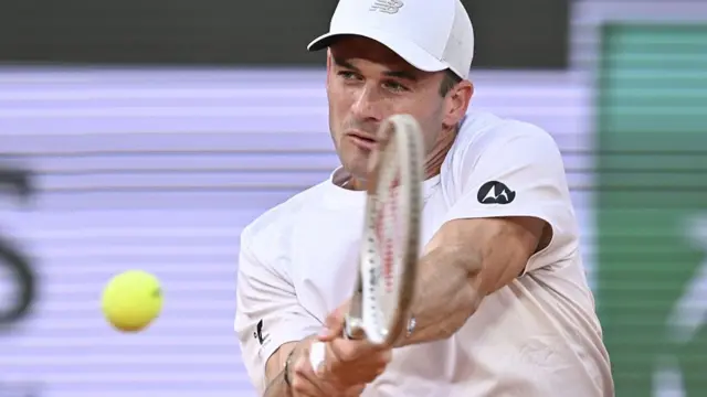 Tommy Paul hits a backhand