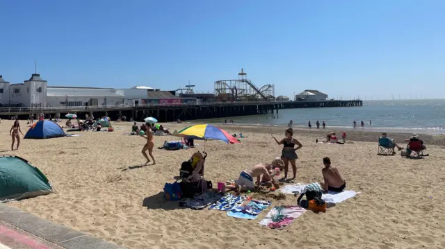 People lying on the beach in Clacton