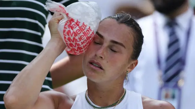 Aryna Sabalenka cools herself with ice