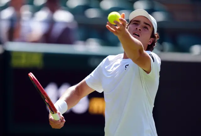Joao Fonseca serves at Wimbledon