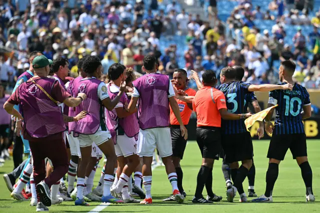Players of both teams argue with Salvadoran referee Ivan Barton