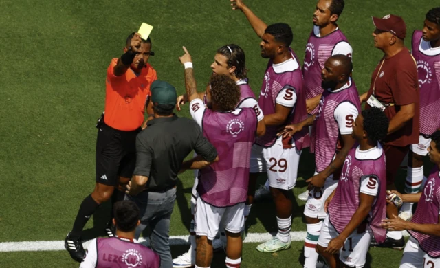 Fluminense coach Renato Gaucho is shown a yellow card