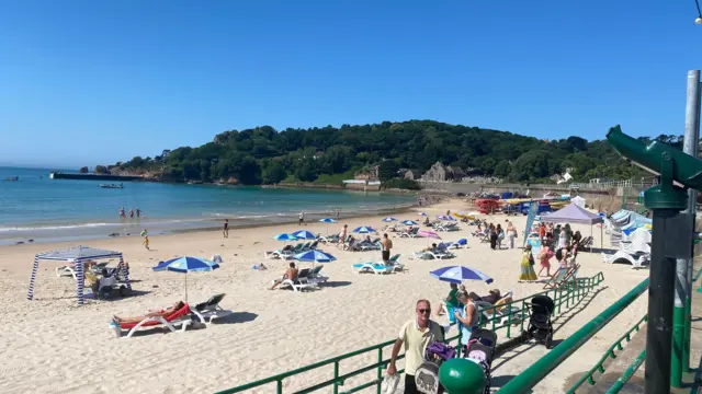 People lying on the beach in St Brelade, Jersey