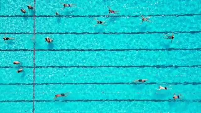 Birds eye view of a lido full of swimmers