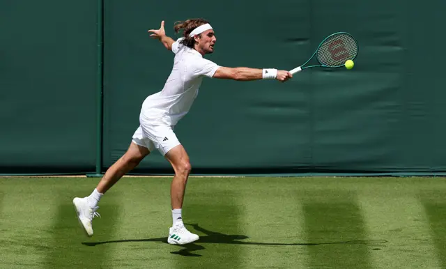 Stefanos Tsitsipas hits a tennis ball