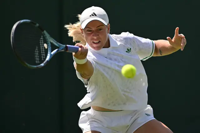Sonny Kartal hits a forehand at Wimbledon