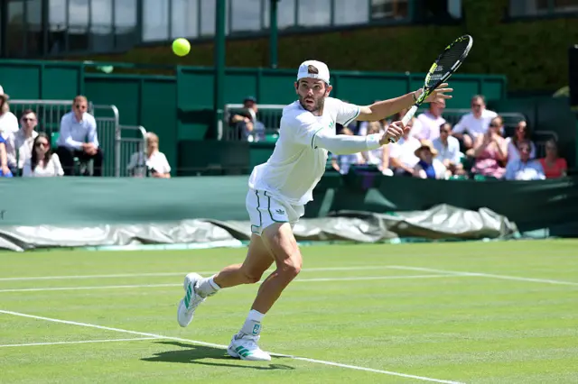 Jacob Fearnley hits a tennis ball