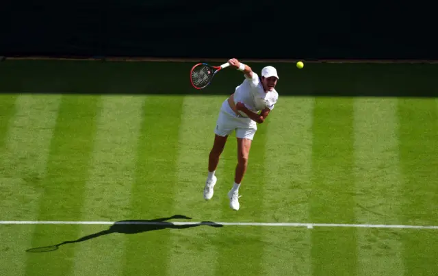 Joao Fonseca serves at Wimbledon
