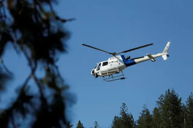A United States Customs and Border Protection helicopter lifts off from Cherry Hill Park after multiple firefighters were attacked when responding to a fire in the Canfield Mountain area outside Coeur d’Alene, Idaho, U.S. June 29, 2025