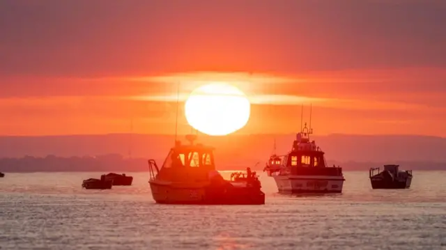 A glorious orange sunrise was captured by this weather watcher off the coast of Selsey in West Sussex