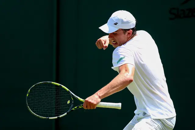Oliver Tarvet celebrates victory at Wimbledon