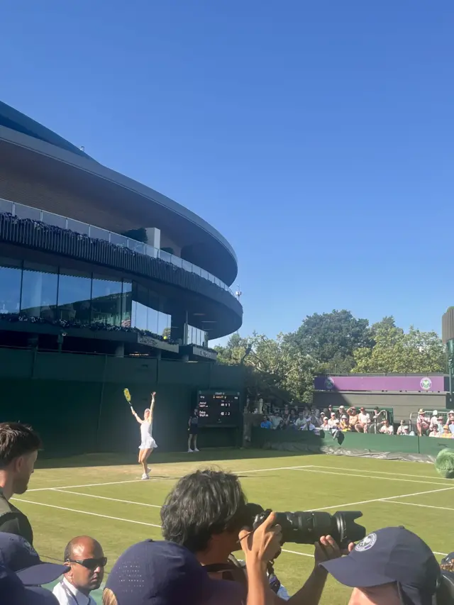 Harriet Dart serves in the second set