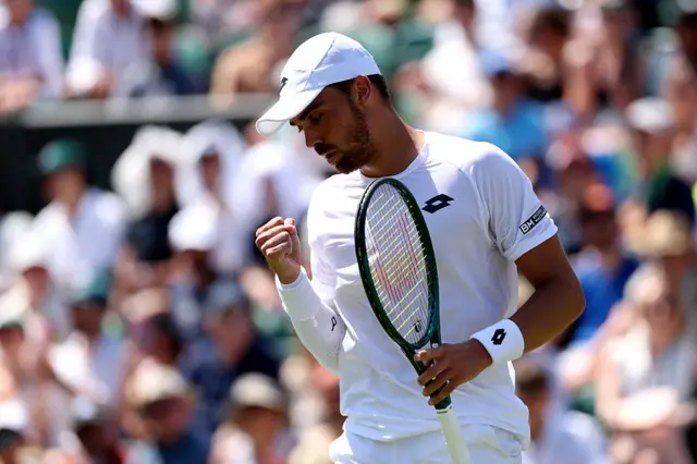 Benjamin Bonzi celebrates victory at Wimbledon