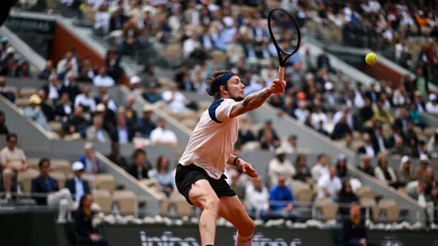 Alexander Bublik volleys the ball