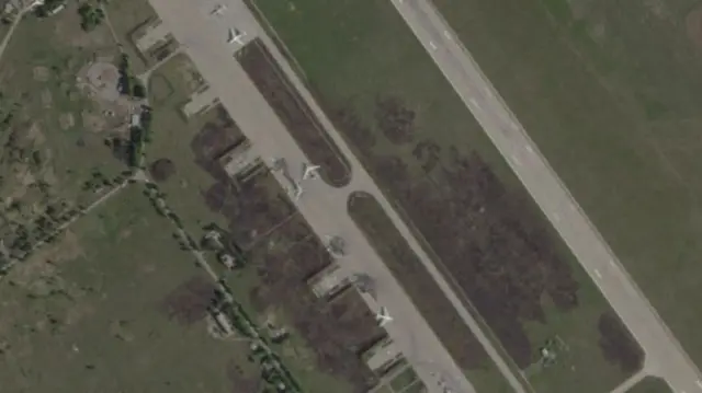 This shot shows damaged aircraft as well as others that remain intact