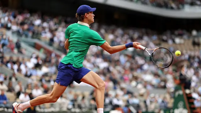 Jannik Sinner plays a forehand
