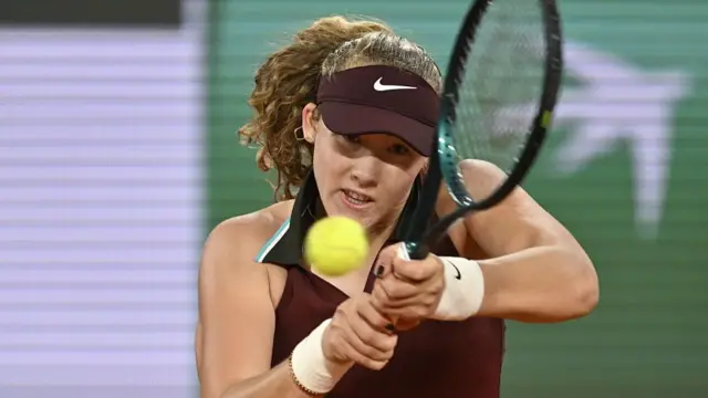 Mirra Andreeva hits a backhand