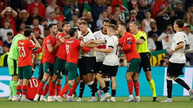 Portugal and Germany players clash