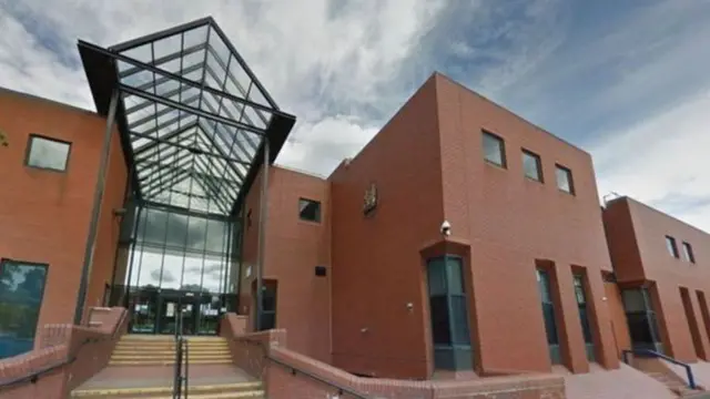 The steps of a red brick court building