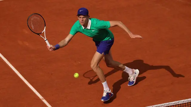Jannik Sinner plays a forehand