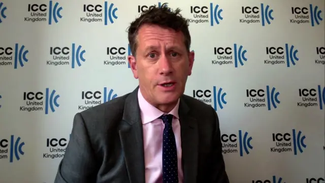 Headshot of Chris Southworth against a white background with the ICC UK logo repeatedly multiple times