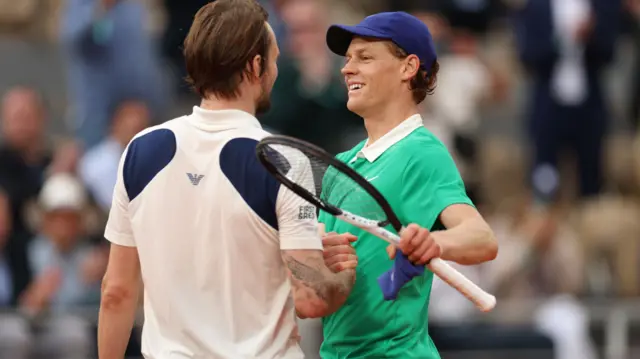 Jannik Sinner hugs Alexander Bublik
