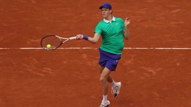 Jannik Sinner plays a forehand