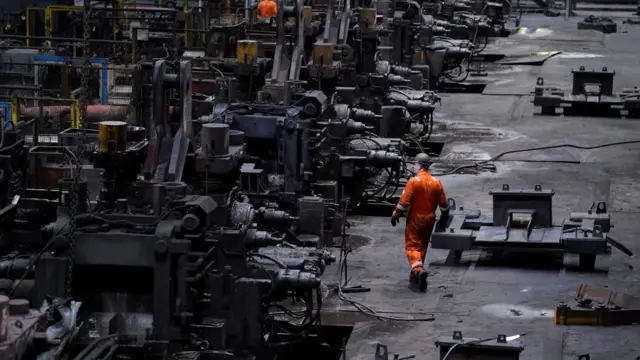 Workers in the rail and sections hot end rolling mill at the British Steel site in Scunthorpe.