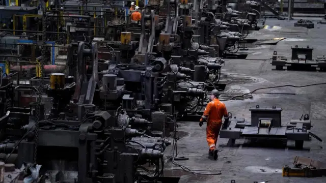 Workers in the rail and sections hot end rolling mill at the British Steel site in Scunthorpe, Lincolnshire,